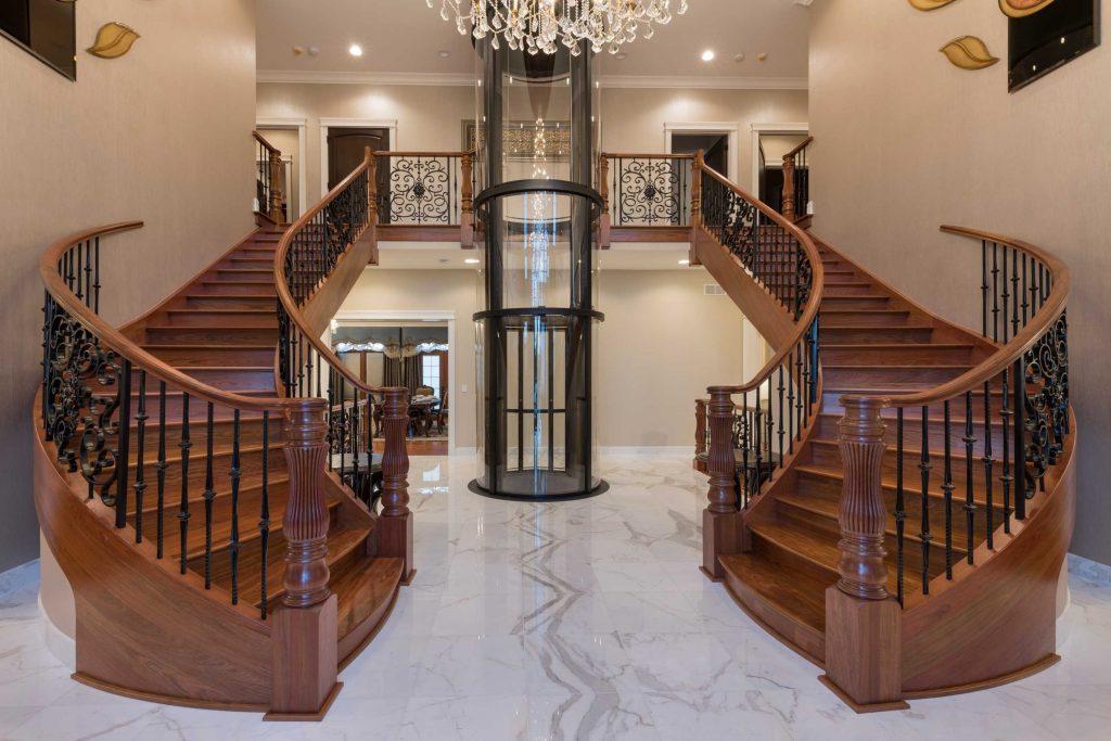round glass elevator in mansion