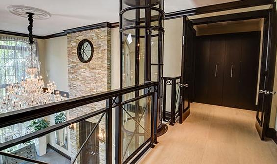 Pneumatic elevator on the second floor landing of a luxury home