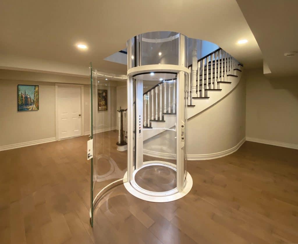 Round glass elevator in luxury home