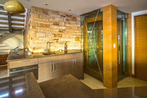 Glass elevator with wood trim